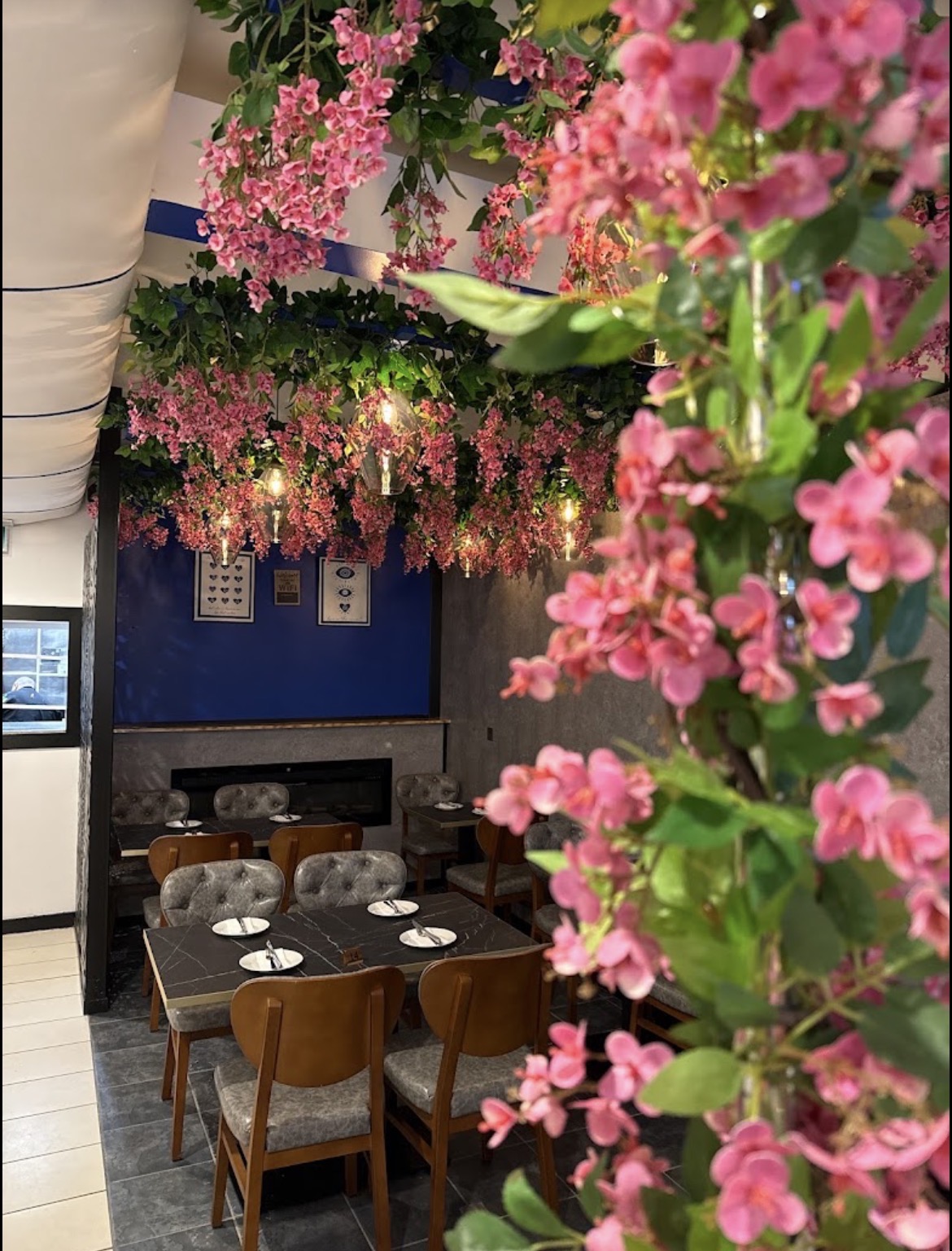 KOS dining room beneath pink blossom decorations